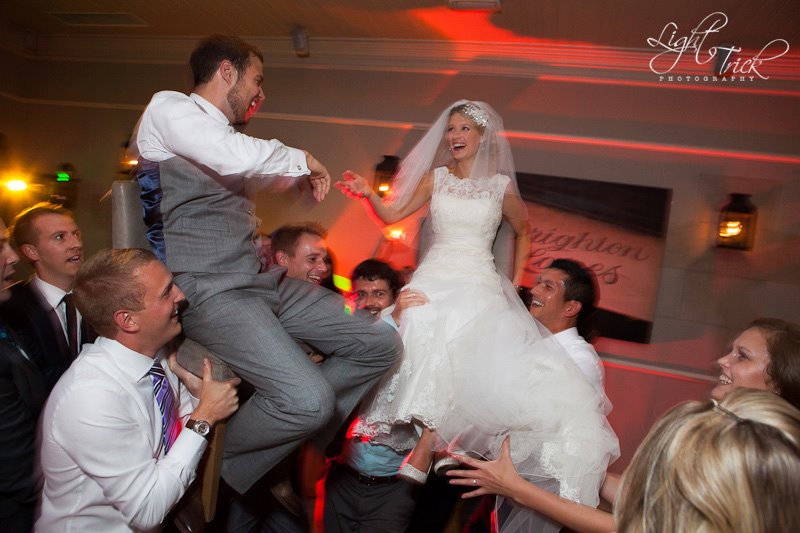 bride and groom lifted in a chair Jewish wedding tradition