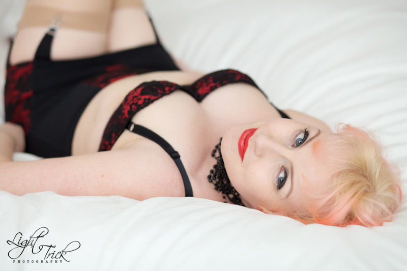 boudoir portrait, redhead posing on bed