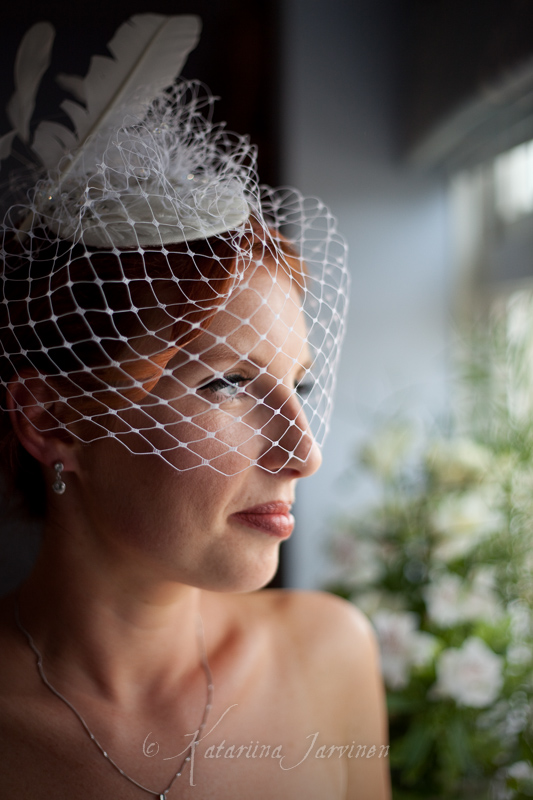 close-up portrait - bride looking out of a window