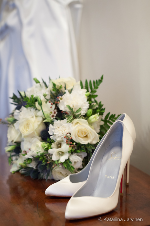 Louboutin white wedding shoes with bouquet