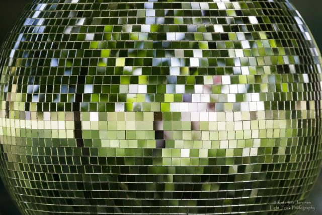 disco ball closeup green reflected trees